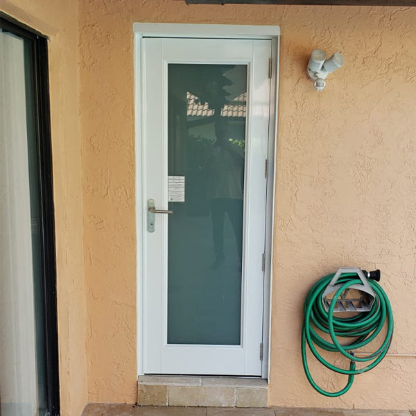 single french full view door opening to Florida home patio pool area on site