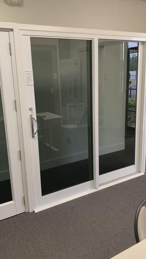 air master sliding glass door in showroom showing high performance multiple railings