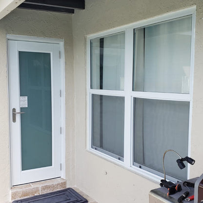 2 single hung windows side by side next to french door